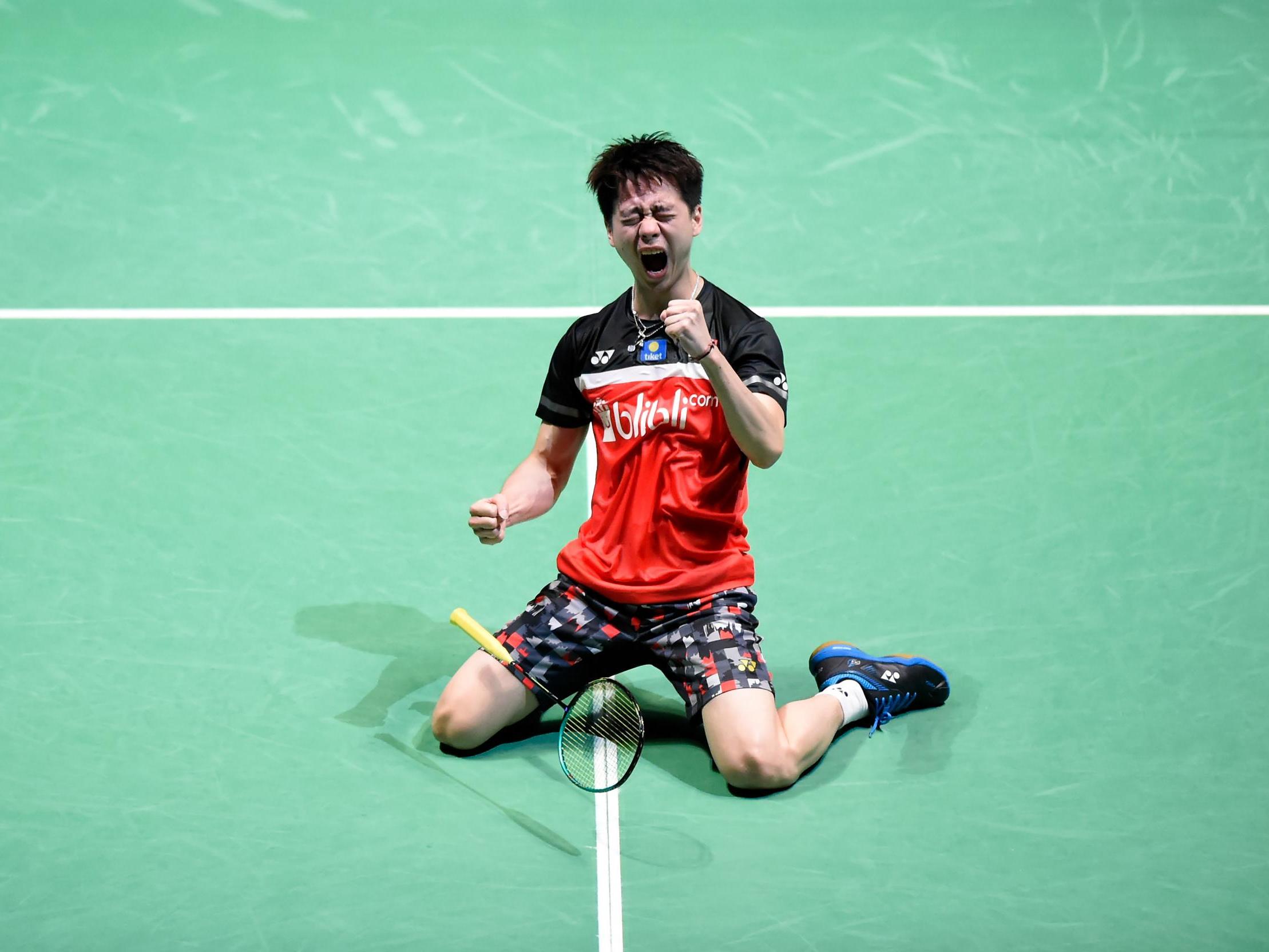 Kevin Sanjaya Sukamuljo celebrates at the Japan Open Badminton Championships