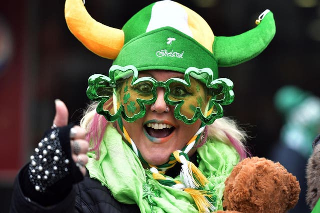 Revellers attend the St Patrick's Day parade in Dublin, Ireland on 17 March 2019
