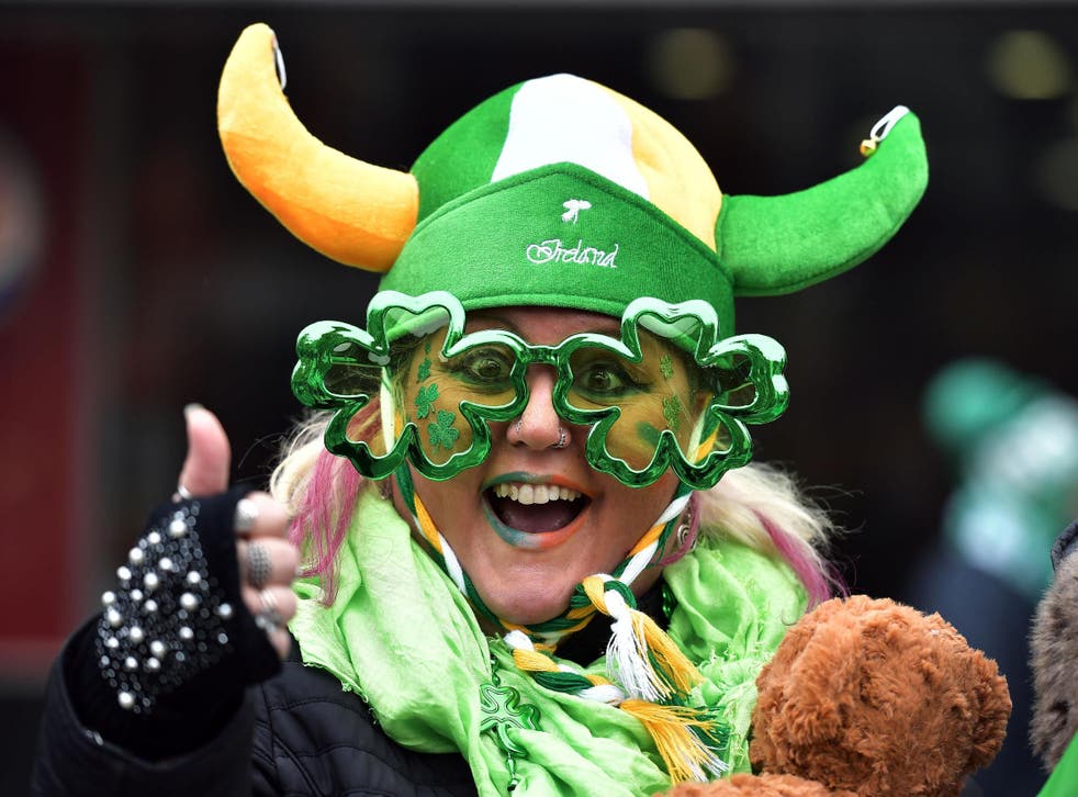 Revellers attend the St Patrick's Day parade in Dublin, Ireland on 17 March 2019