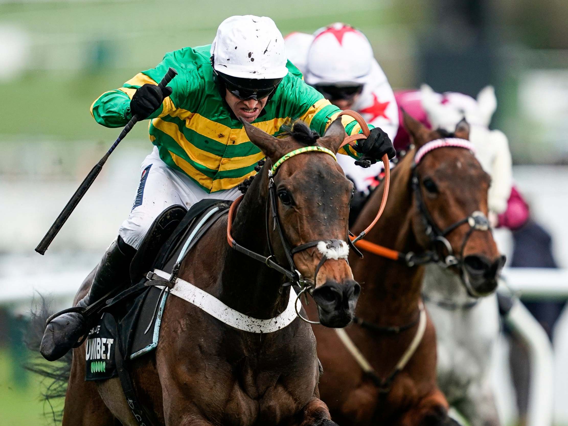 Barry Geraghty riding Epatante (green/gold) clear the last to win The Champion Hurdle Challenge Trophy