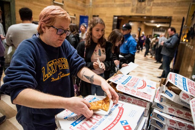 Pizza arrives to feed people waiting in line at Kalamazoo City Hall, Michigan.