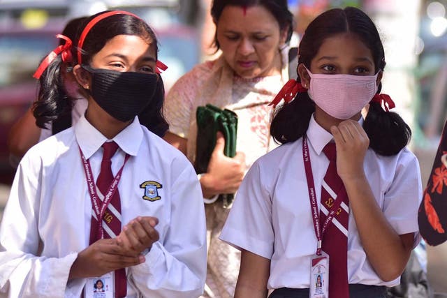 School children wear protective face masks in Guwahati, India on 11 March 2020.