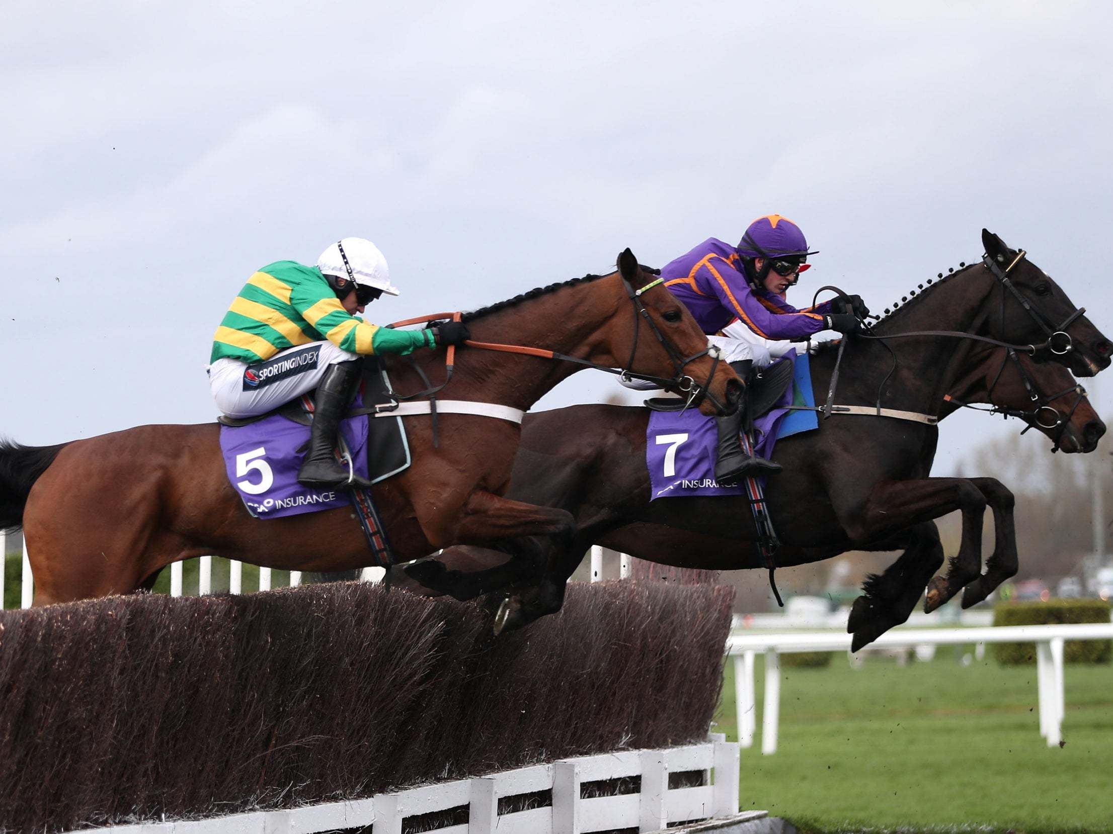 Champ ridden by jockey Barry Geraghty (left) on their way to wining the RSA Chase