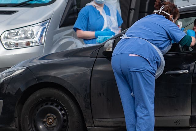 People are swabbed at a drive-thru coronavirus testing station in Wolverhampton