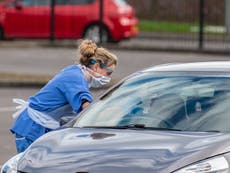 Drive-thru coronavirus test station opens in UK car park