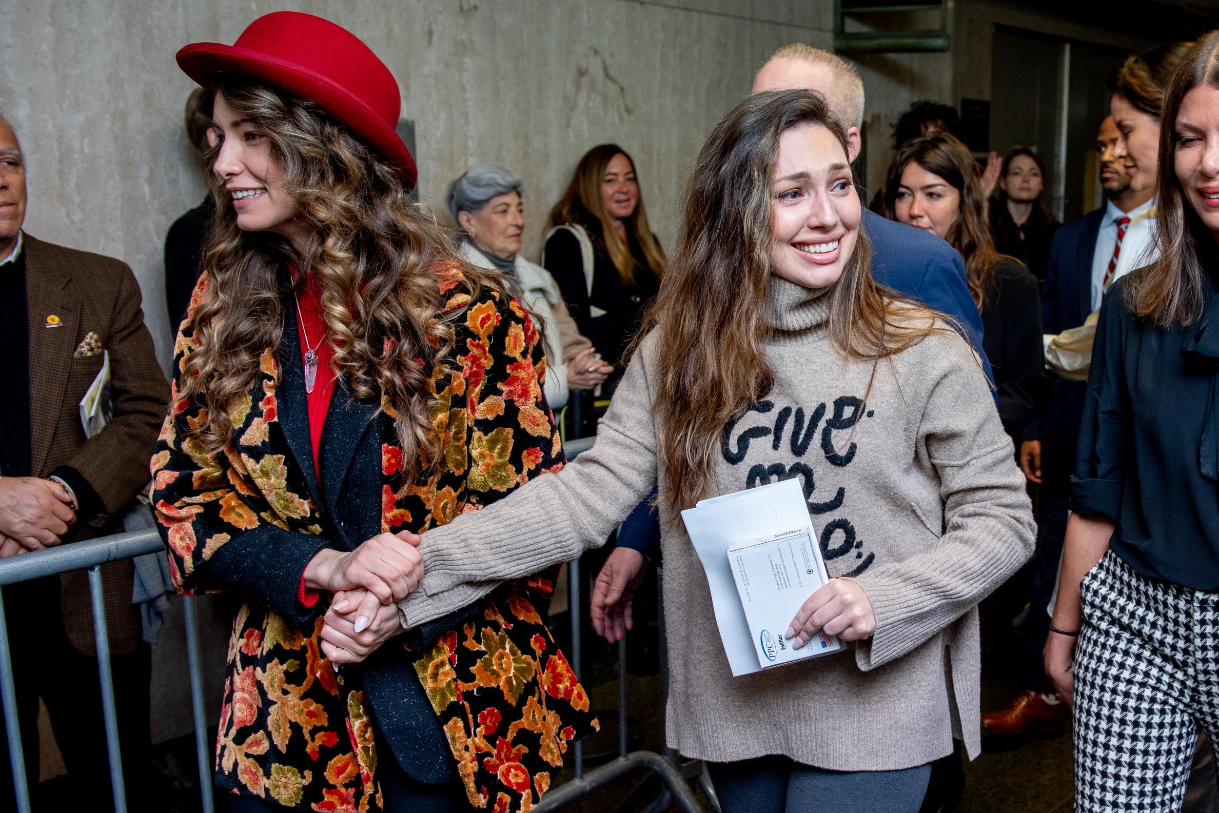 Lauren Young (L) and Jessica Mann (R) walk out of the courtroom after Weinstein was sentenced to 23 years in prison on 11 March 2020 in New York City.