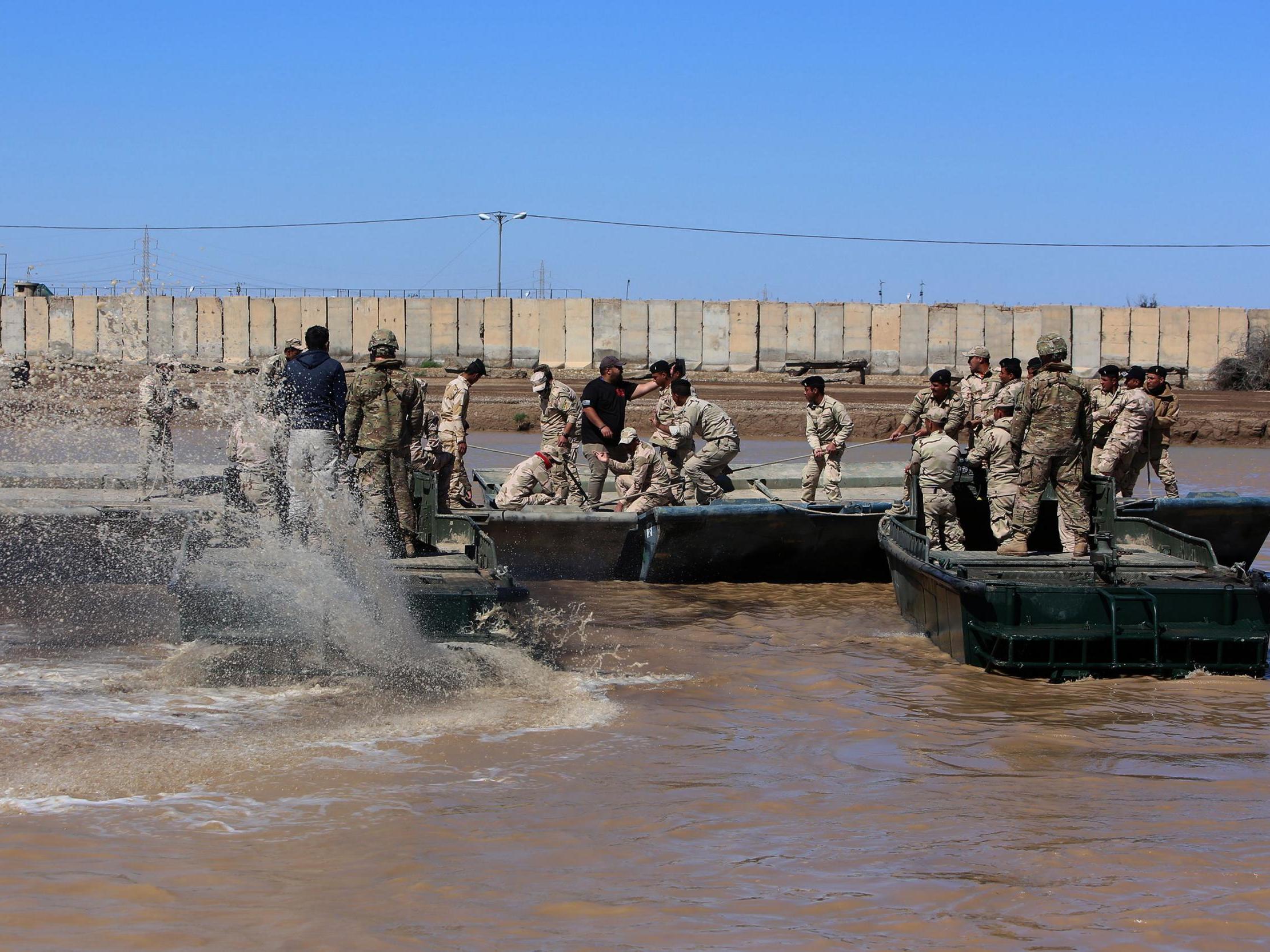 Coalition forces and Iraqi soldiers during a 2017 training session at Camp Taji, where a British medic and two Americans were killed by a rocket attack on 11 March, 2019