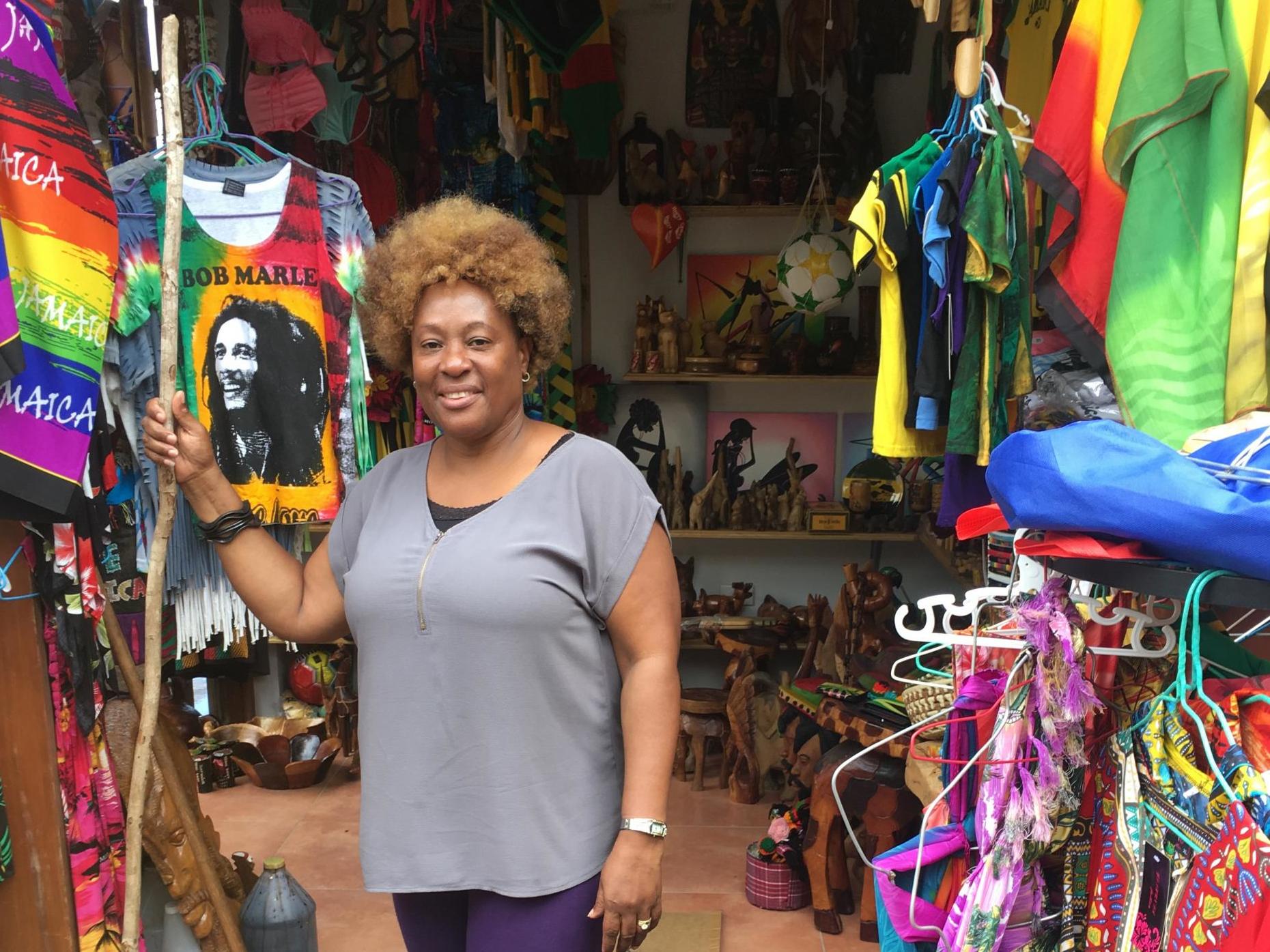 Verona Addison stands before her shop, Tucker Save-a-Dollar Craft and Gift Shop in Ocho Rios port Jamaica