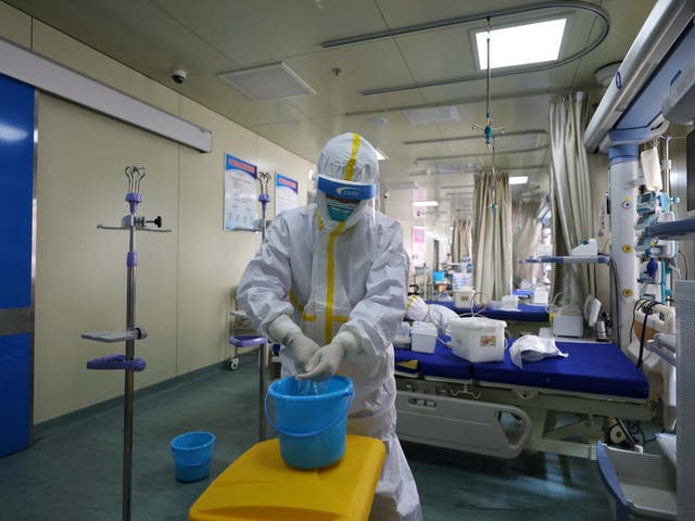 Medical workers in protective suits disinfect an intensive care unit (ICU) ward of Union Jiangbei Hospital in Wuhan