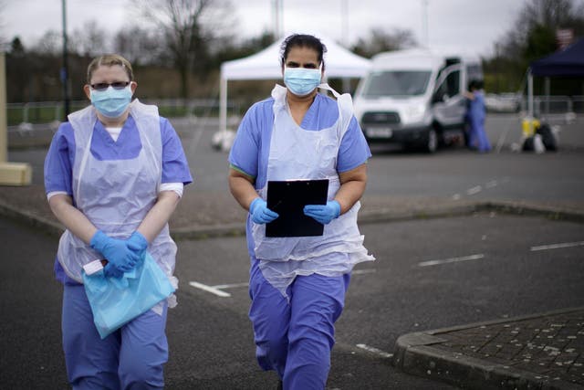 NHS nurses wait for the next patient at a drive through Coronavirus testing site in a car park on March 12, 2020 in Wolverhampton, England