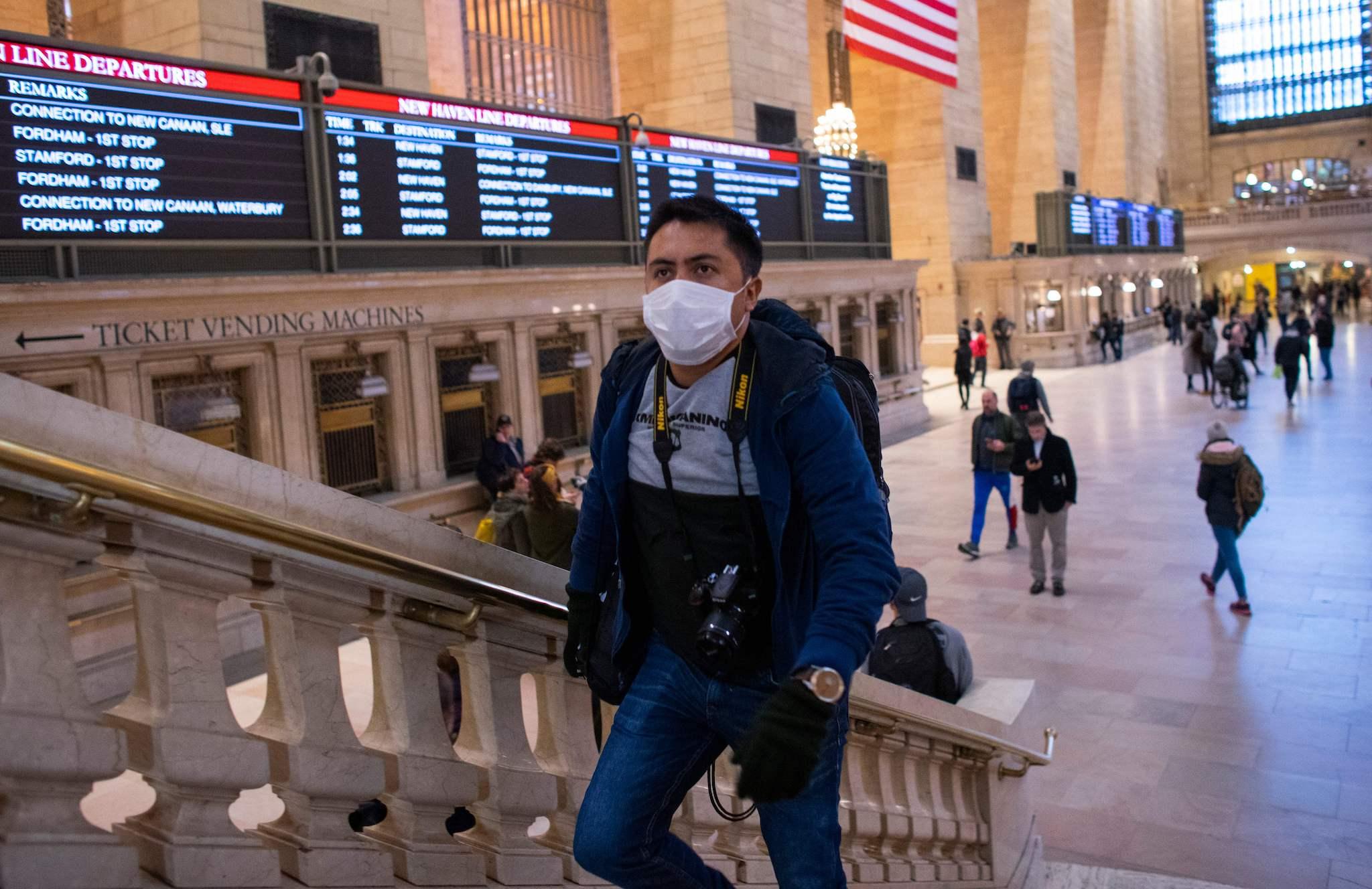 A man wears a face mask as he walks inside Grand Central Station on March 8, 2020 in New York City