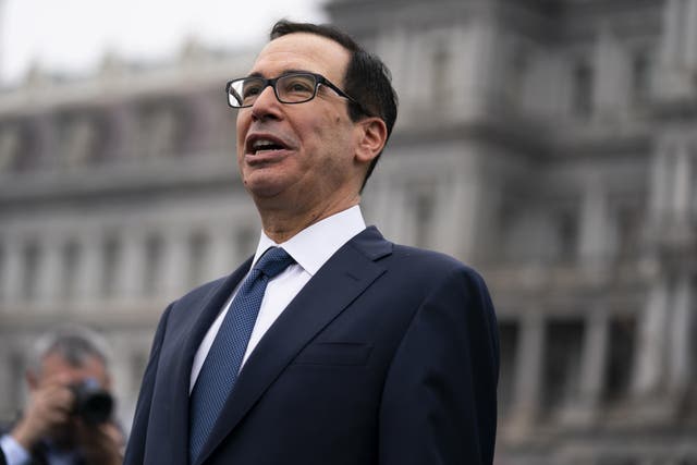 Treasury Secretary Steven Mnuchin said he has a 'glass half full' as he projects a bounce back for the economy. (Photo by Evan Vucci/AP)