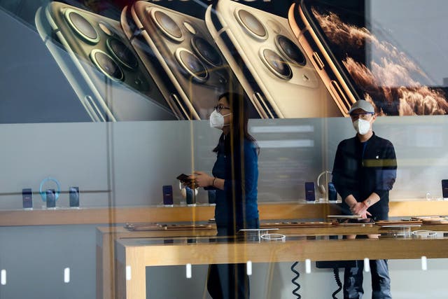 Employees wear face masks at Apple Store in Beijing on February 17, 2020 in Beijing, China