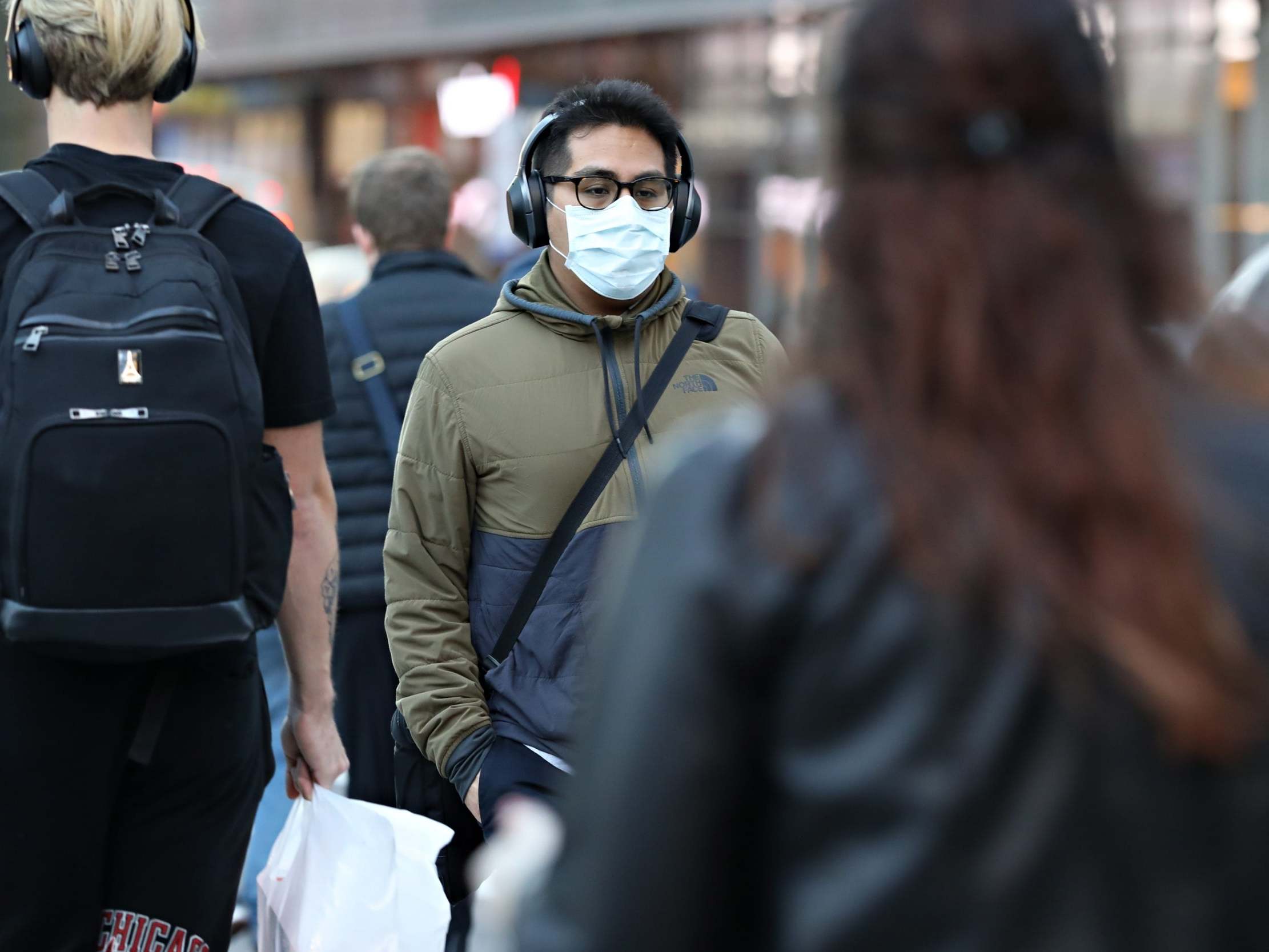 A man wearing a protective mask is seen on 13 March 2020 in New York City