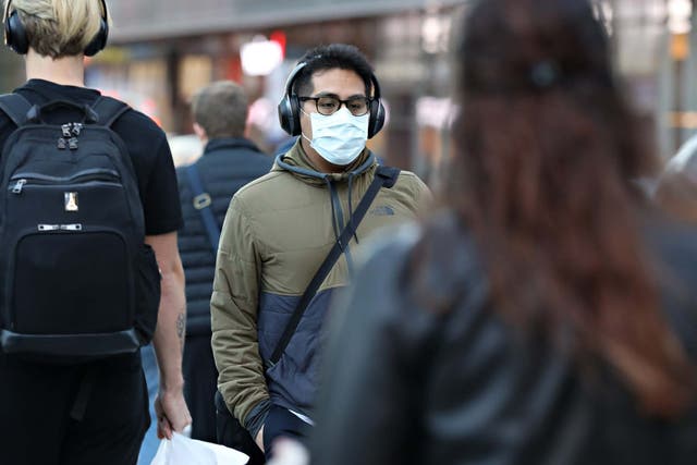 A man wearing a protective mask is seen on 13 March 2020 in New York City
