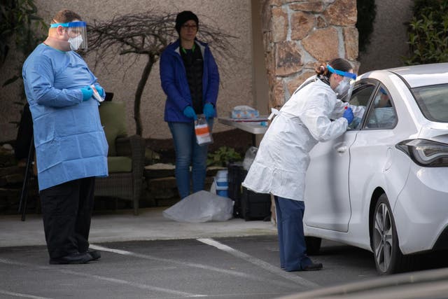 Health workers in Seattle have been testing people at drive-thru facilities