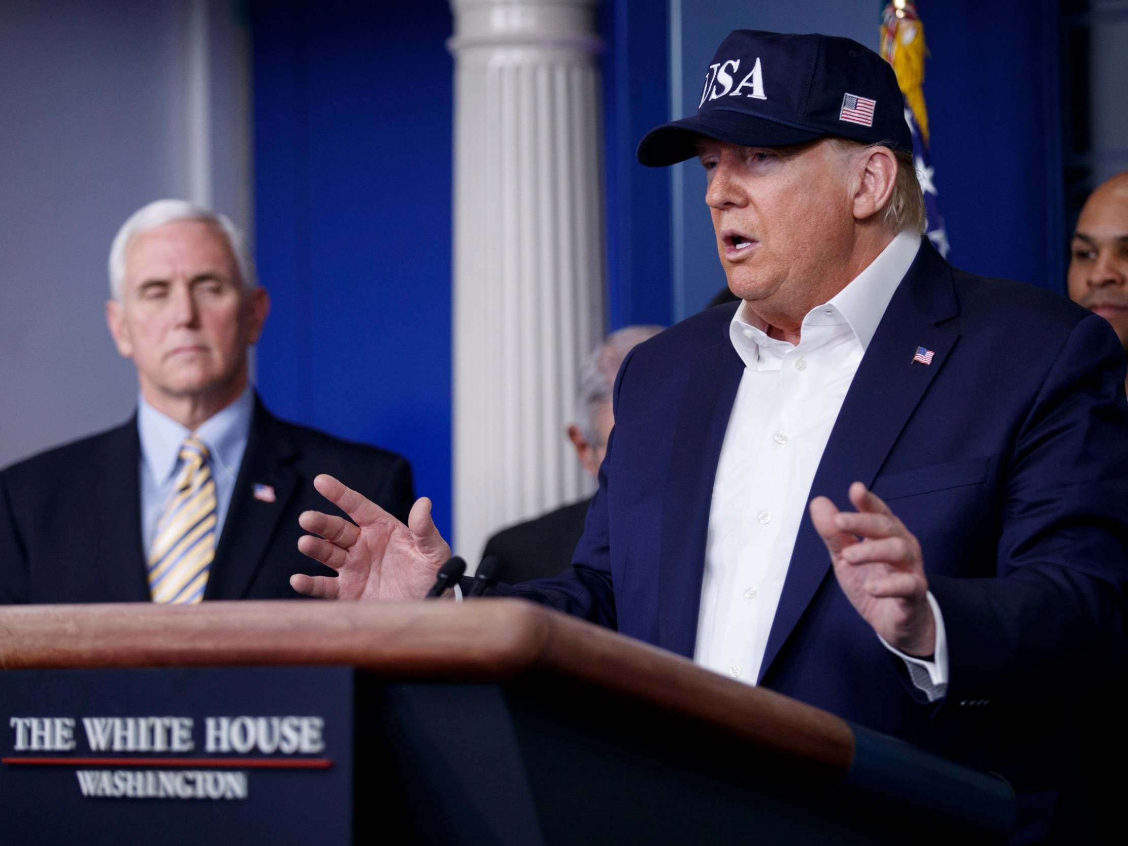 Donald Trump and Mike Pence confirm the UK travel ban at a press conference in the White House