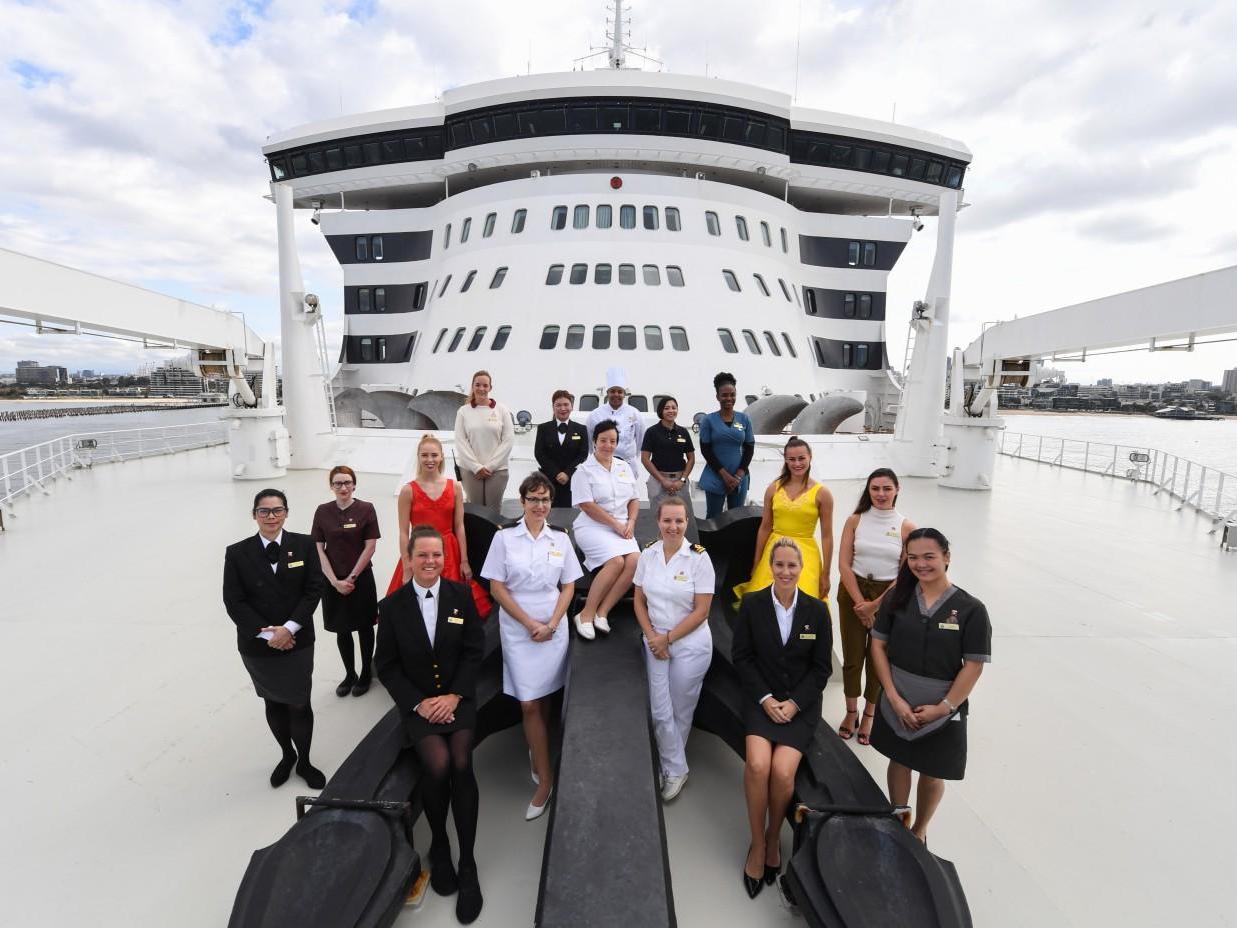 Female crew members on board Cunard's Queen Mary 2 berthed at Station Pier in Melbourne Australia on 8 March 2020