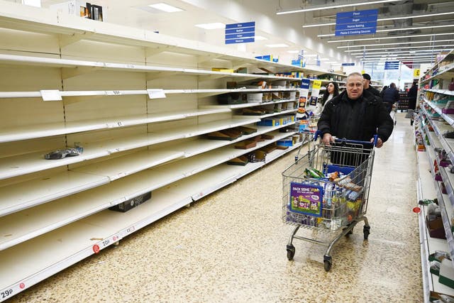 Empty supermarket shelves amid panic buying