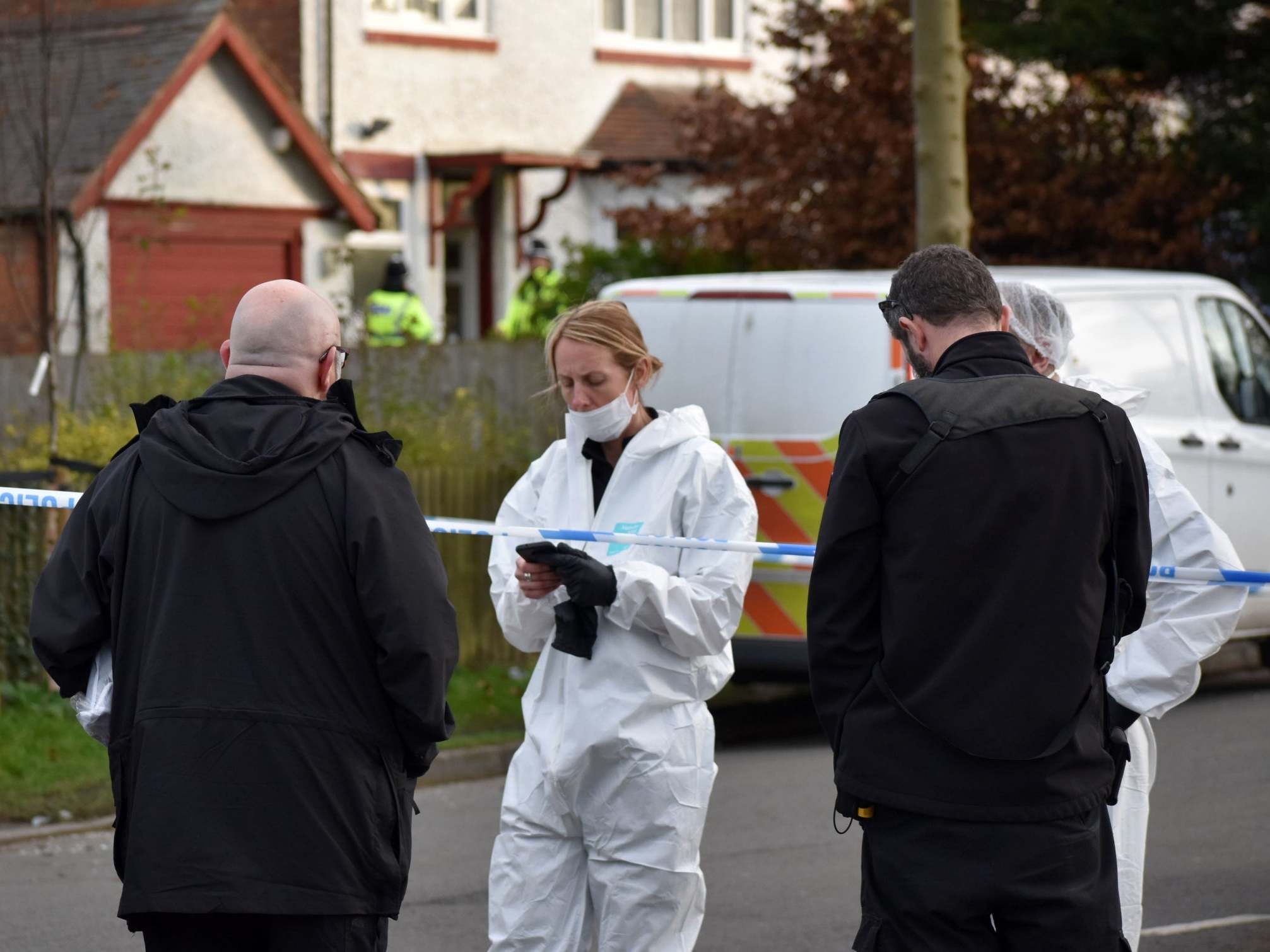 Forensic officers at the scene of a double murder investigation in Moseley, Birmingham
