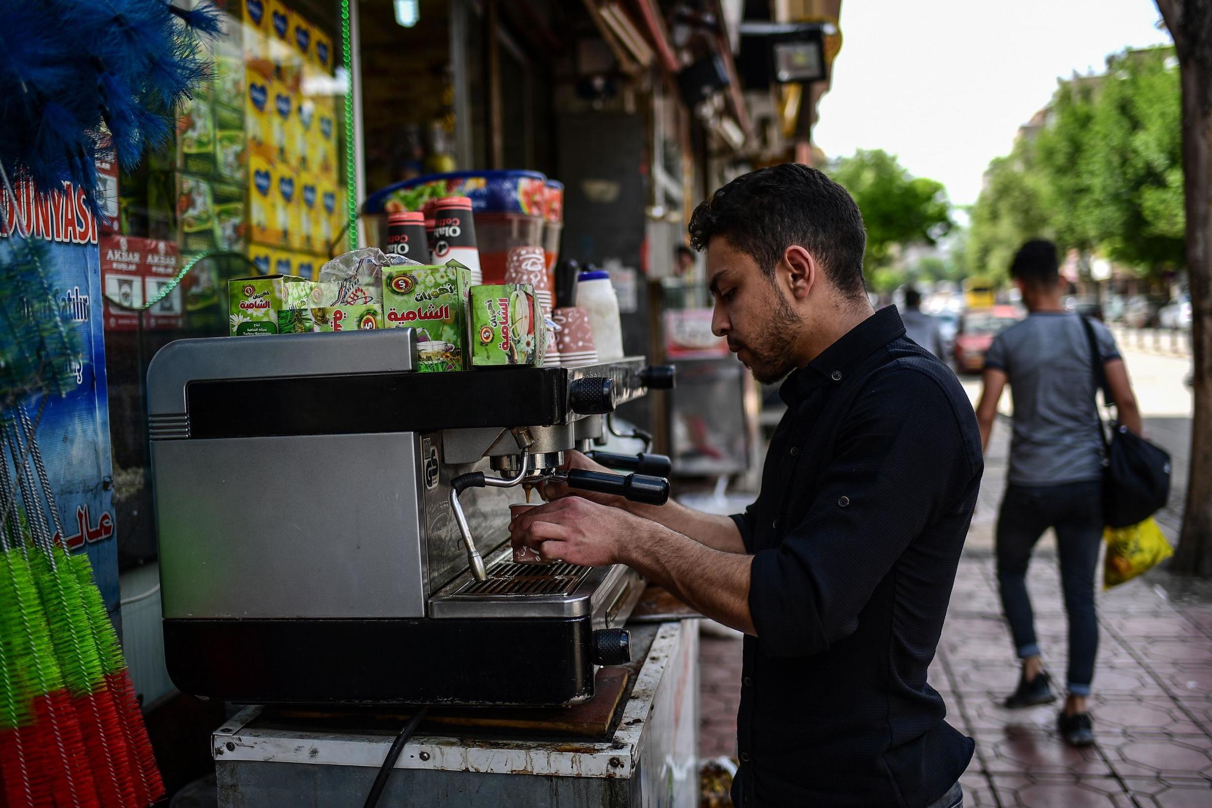 A Syrian coffee vendor makes a coffee in Gaziantep, in the southwest of Turkey (AFP/Getty)