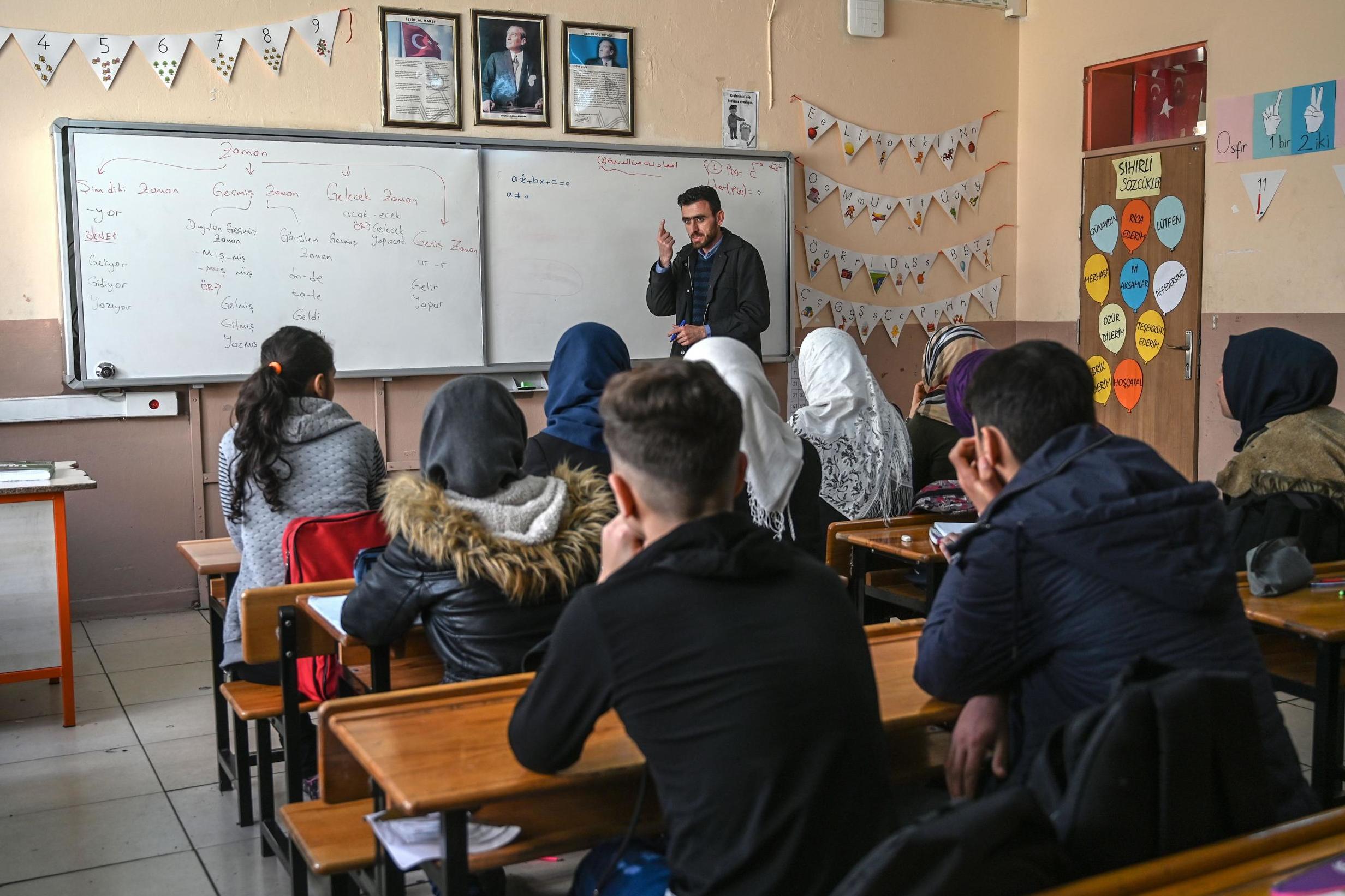 A Syrian teacher gives a maths class to Syrian children in a classroom at Sehit Duran primary school in Adana in southern Turkey (AFP/Getty)