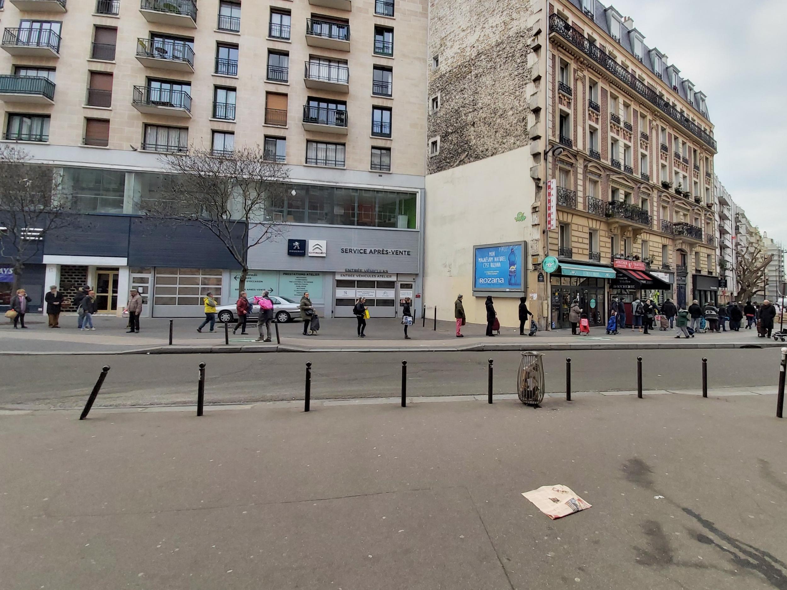 A queue for a supermarket stretches for hundreds of metres in Paris, France, ahead of the midday lockdown, 17 March, 2020