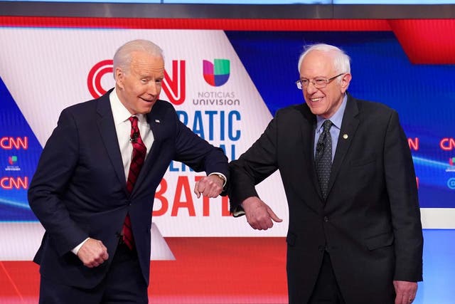Joe Biden and Bernie Sanders greet with the coronavirus ‘handshake’ (Re