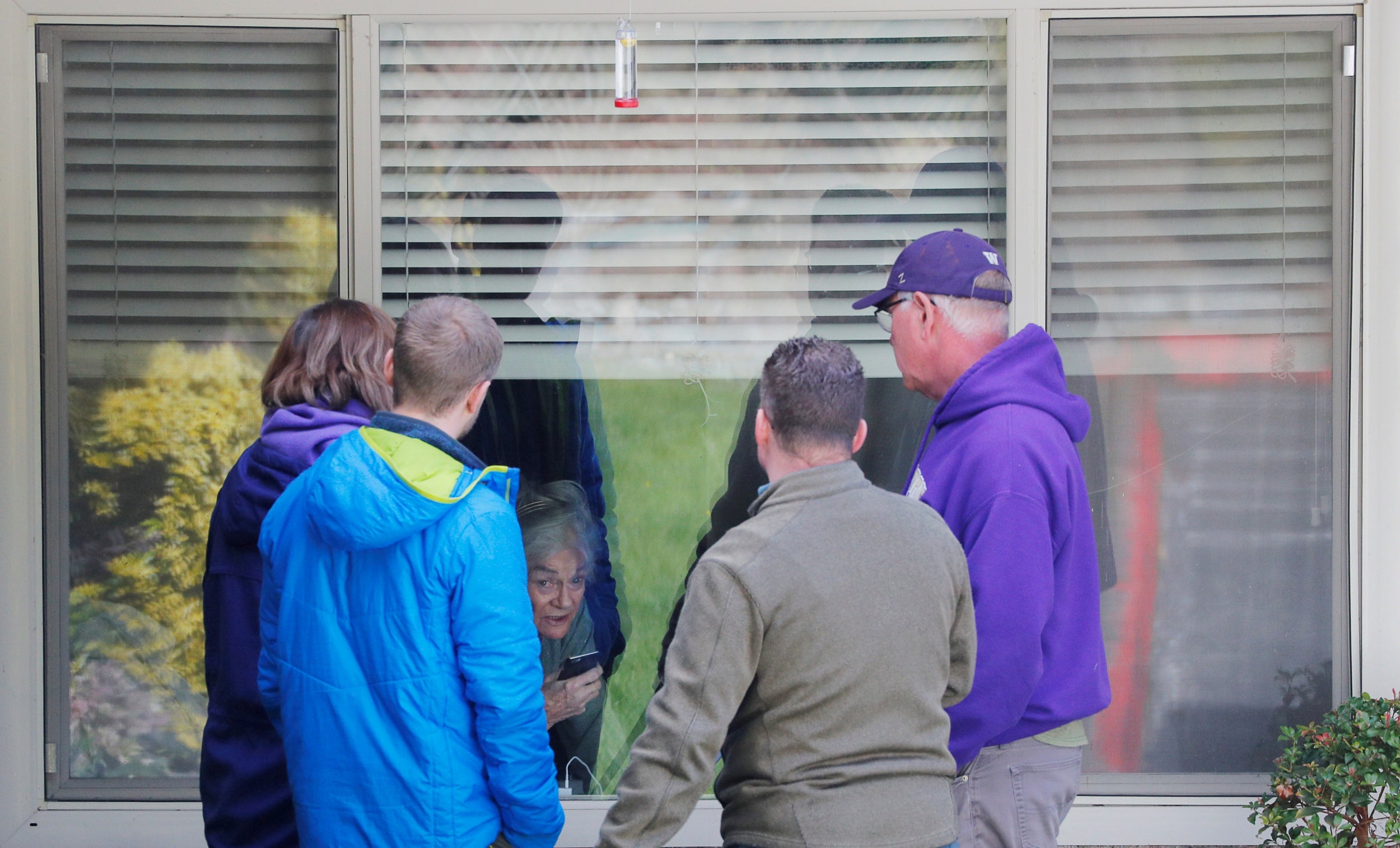 Families across America have taken to visiting elderly relatives in care homes via their windows (Reuters)