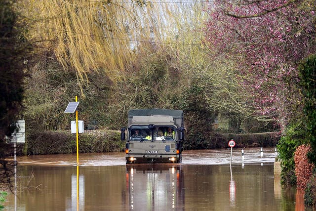 The army helps residents of Hampton Bishop in Hereford last month: it could be called out again