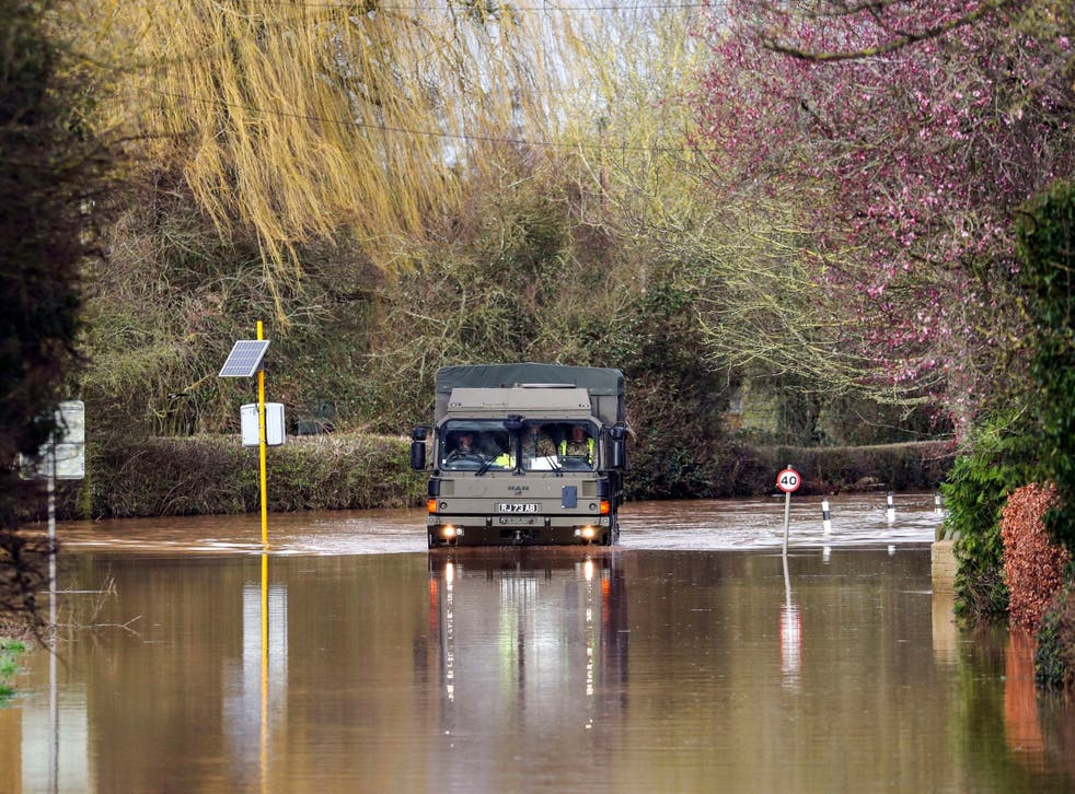 The army helps residents of Hampton Bishop in Hereford last month: it could be called out again