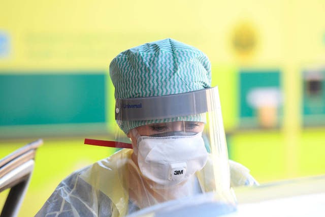 An A&E nurse wears full protective equipment which is running out in some parts of the NHS