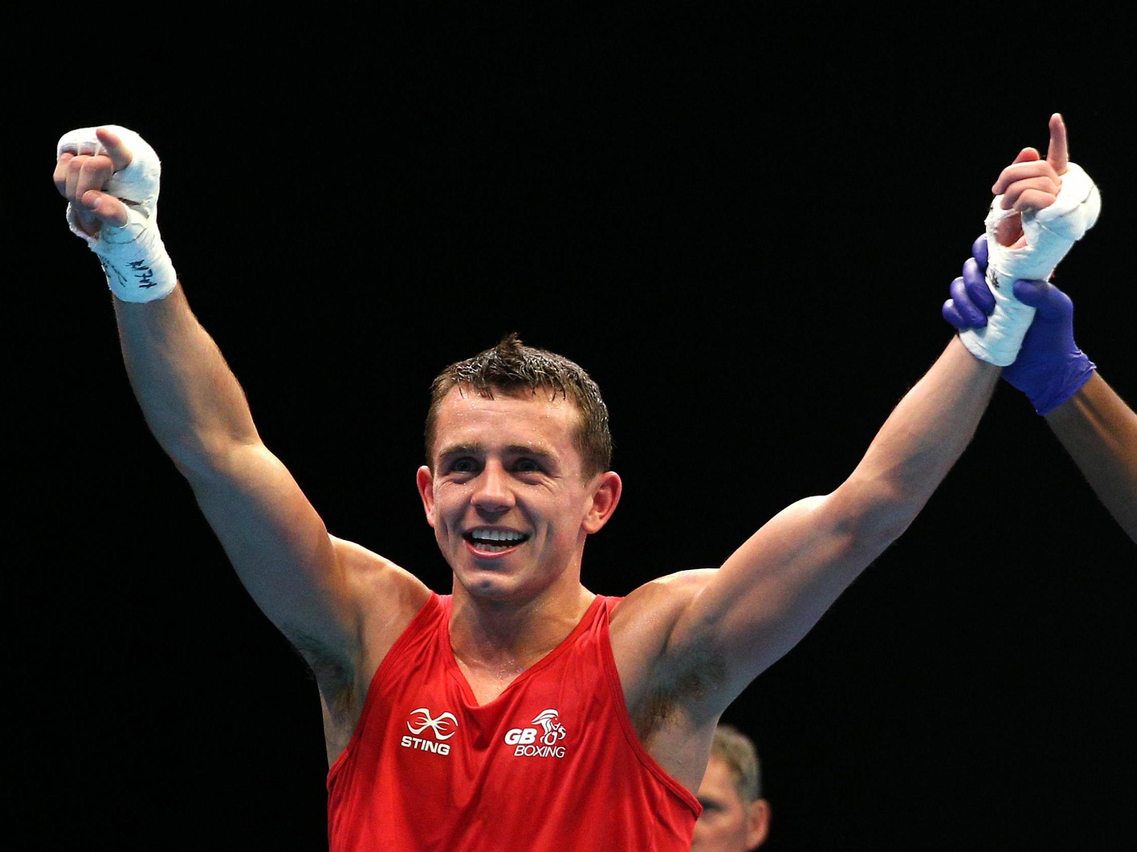 Peter McGrail celebrates defeating Kevin Godla to qualify for the 2020 Olympics