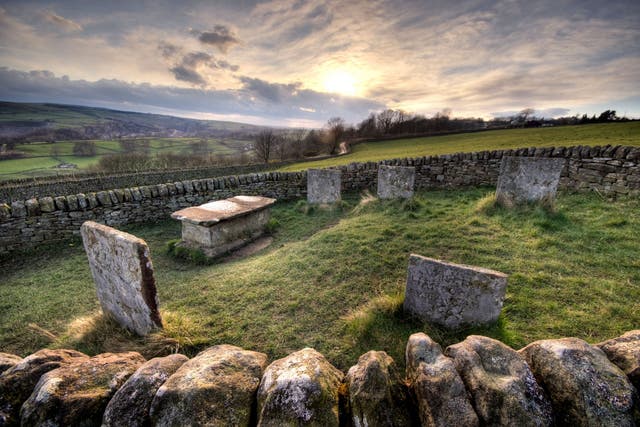 The sun sets over plague graves in Eyam