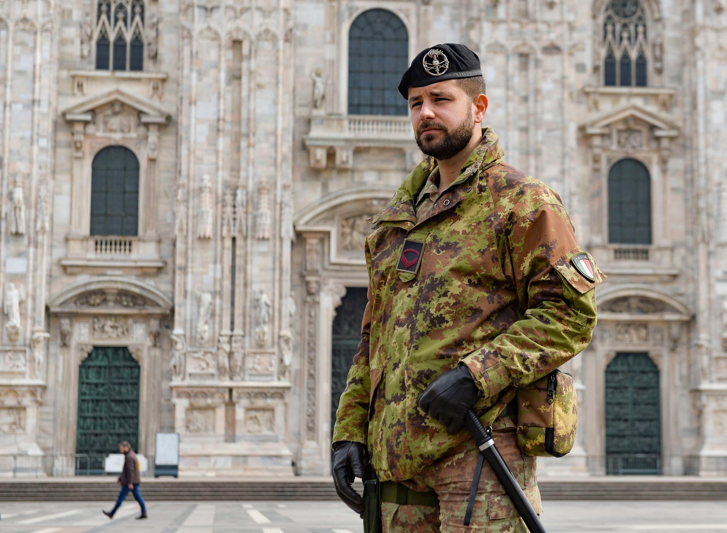 Soldiers of the Italian army patrol around the Piazza del Duomo, Milan