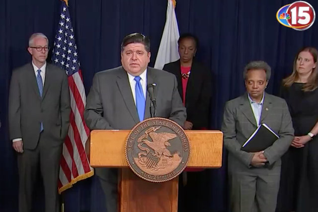 Illinois Governor JB Pritzker (centre) and Chicago Mayor Lori Lightfoot (right) at a news conference on 20 March 2020.