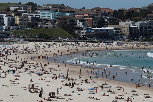 Beachgoers enjoy a sunny day at Bondi Beach despite growing concerns about the spread of the coronavirus disease in Sydney, Australia
