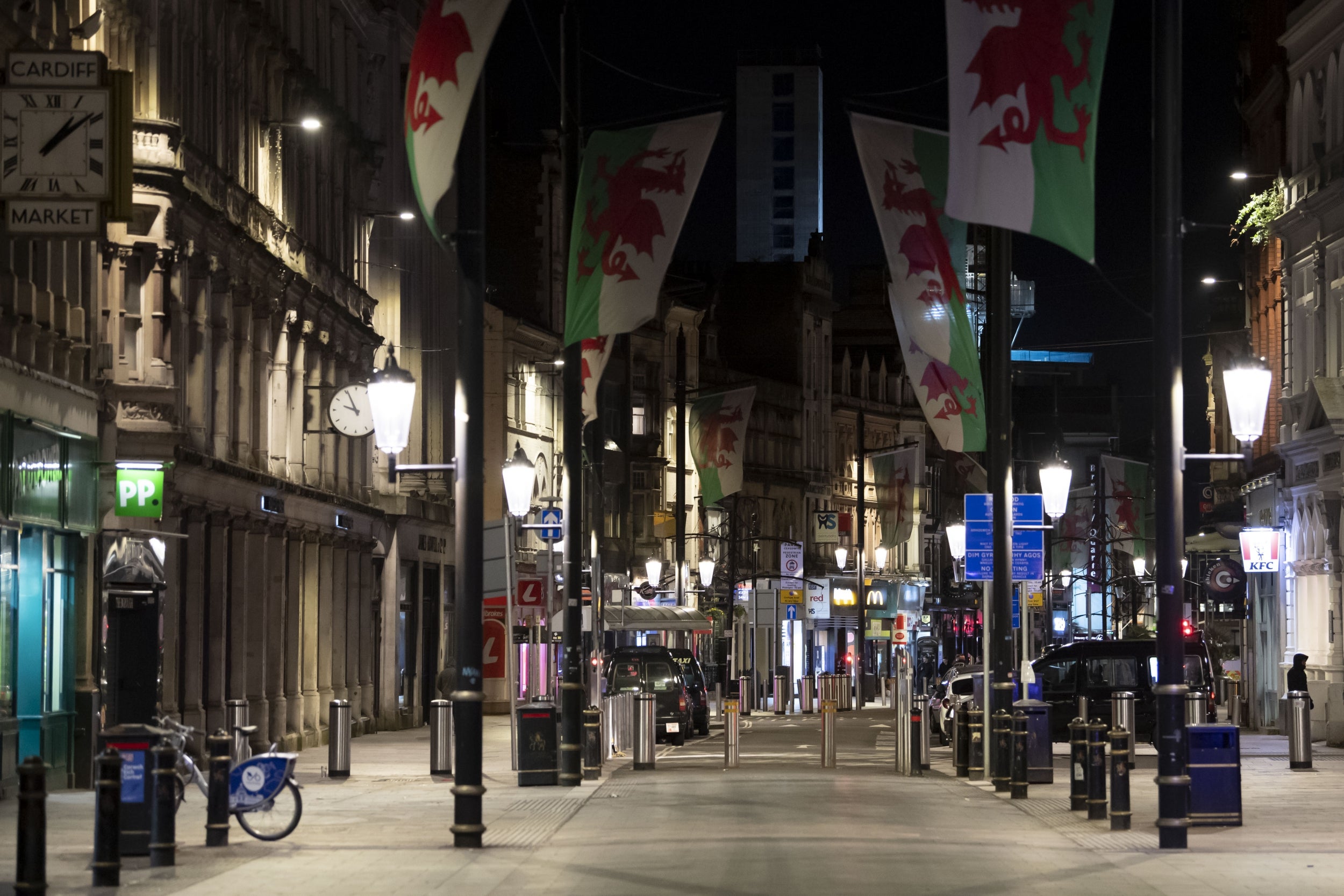 St Mary's Street in Cardiff is deserted on a Friday night after the government ordered pubs, restaurants and other social venues to  close