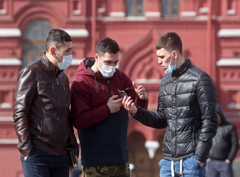 Moscovites wearing face masks in Red Square: the country has seen relatively few cases of Covid-19 so far