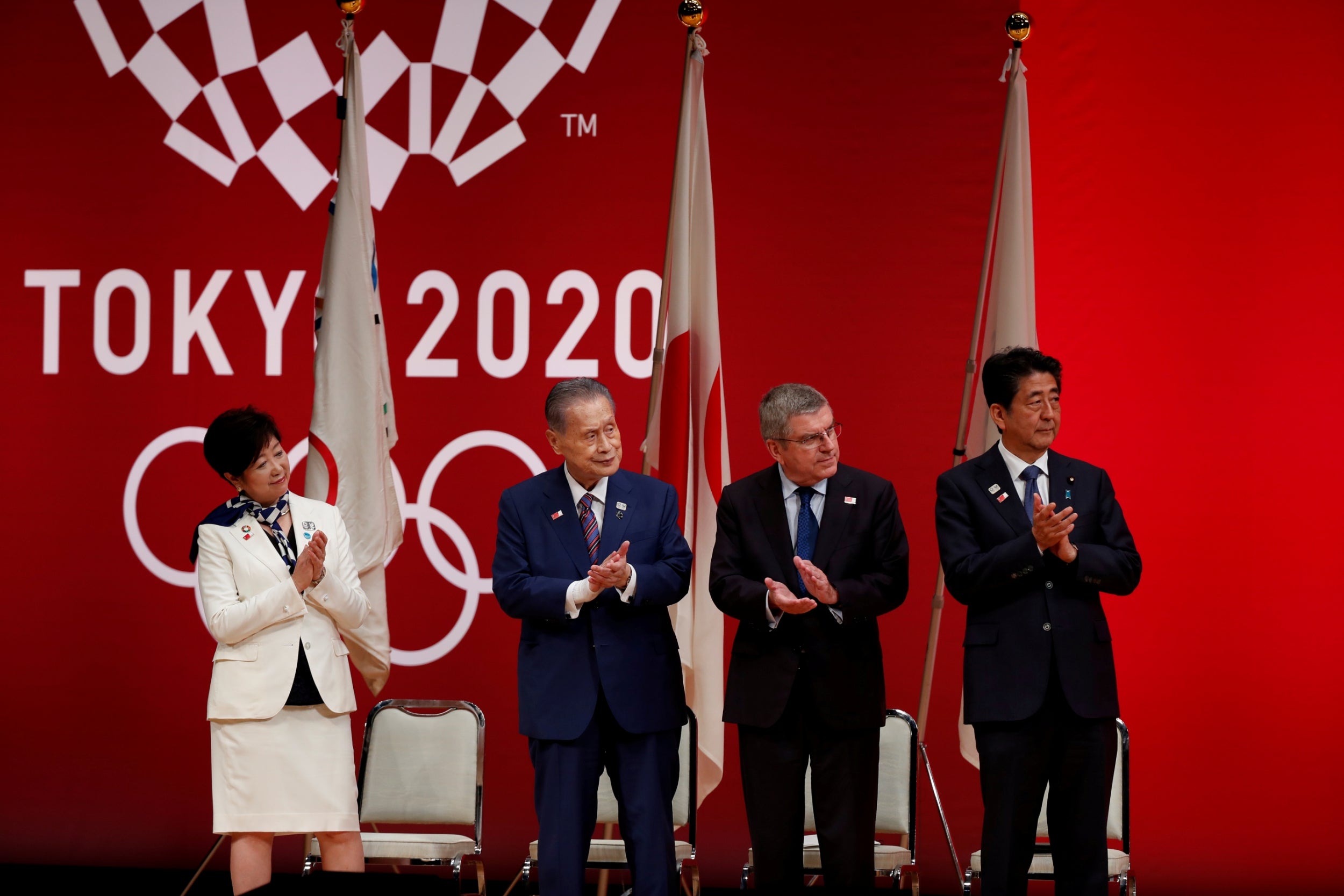 Tokyo 2020 chief Yoshiro Mori (second from left) admits the Games could be postponed