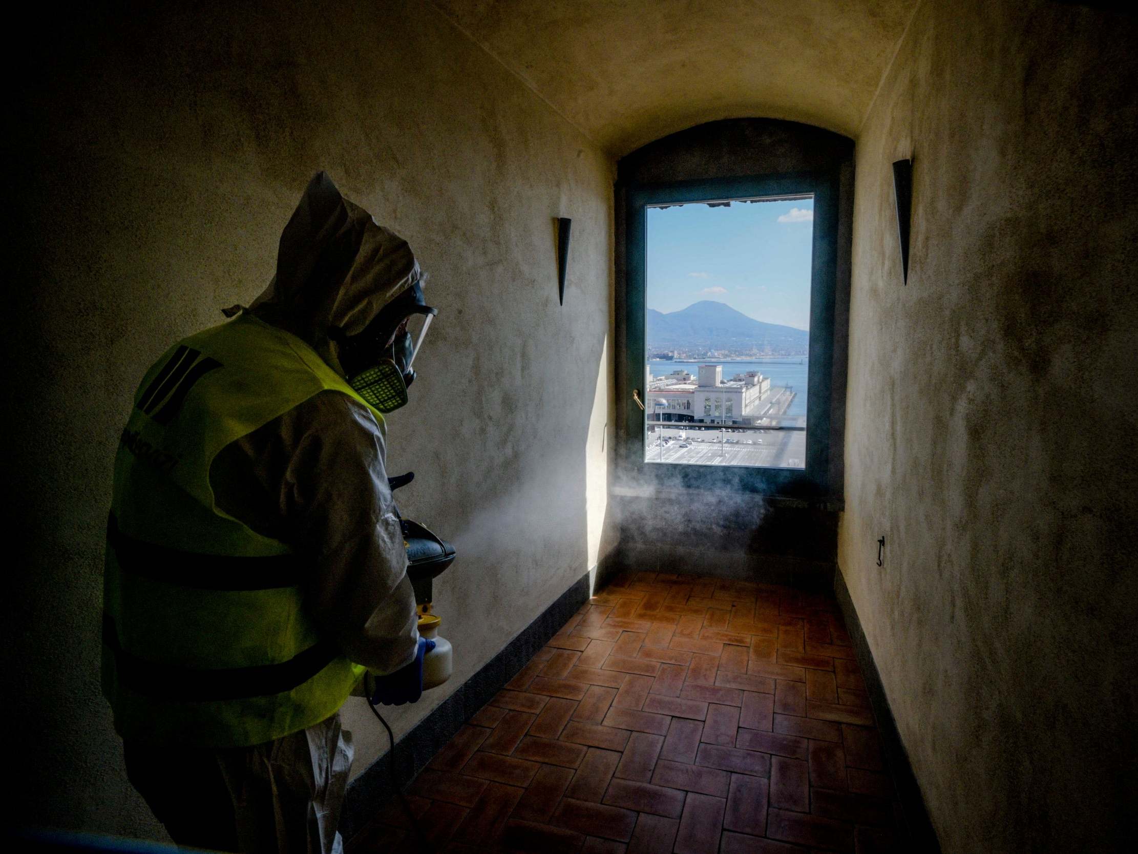 A worker disinfects the Maschio Angioino castle museum in Naples, Italy, the worst-affected country in Europe