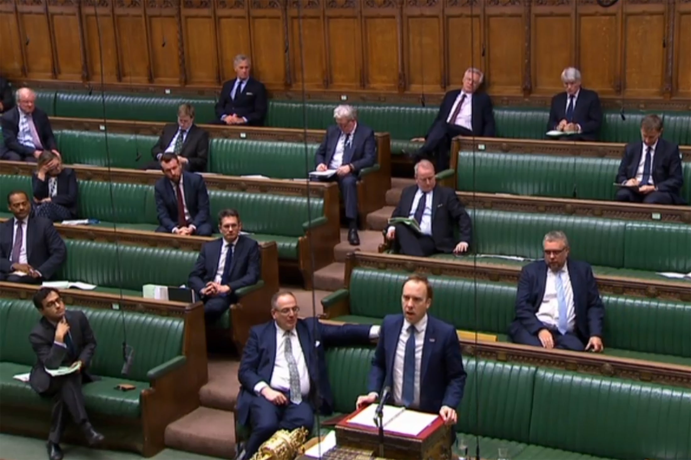 MPs observed social distancing guidance by spacing themselves out on the Commons green benches during debate on the emergency coronavirus bill