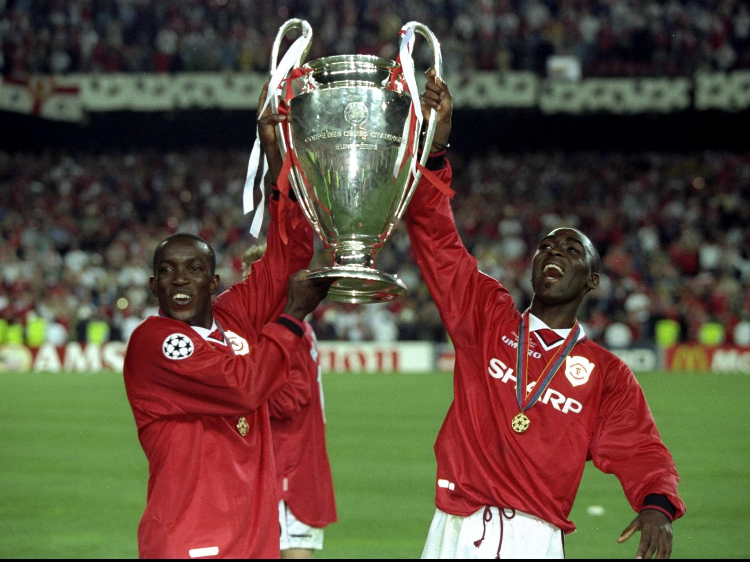 Yorke and Cole celebrate winning the Champions League