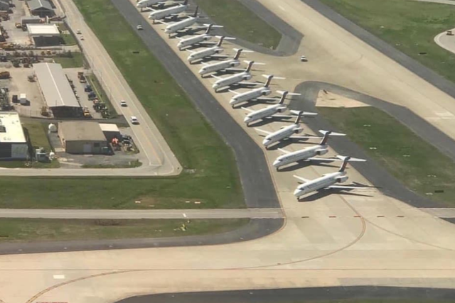 Delta planes are parked on an Atlanta airport runway