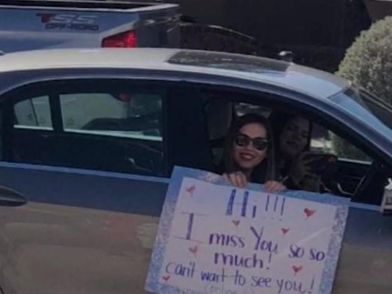 Teacher Leslie Gonzalez drove past 25 students' houses with a poster board to tell them that she missed them