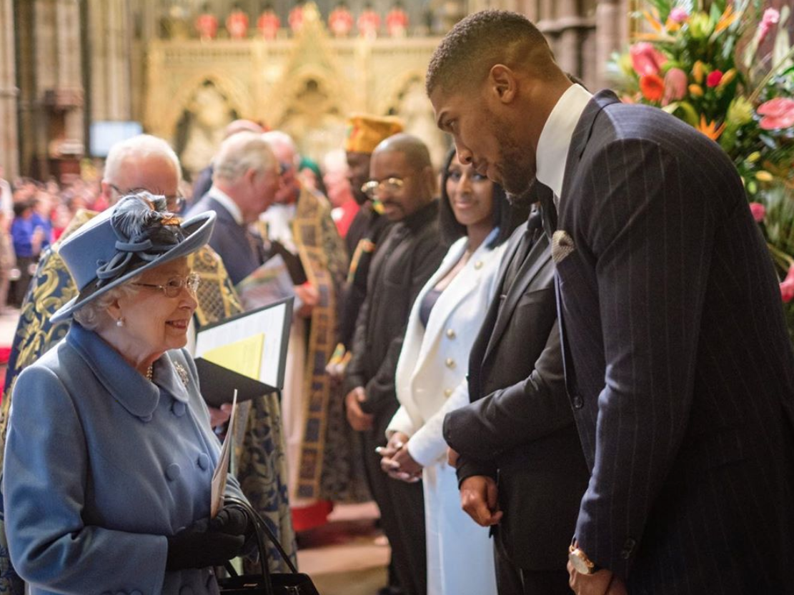 Anthony Joshua met Prince Charles (background) and The Queen on 9 March