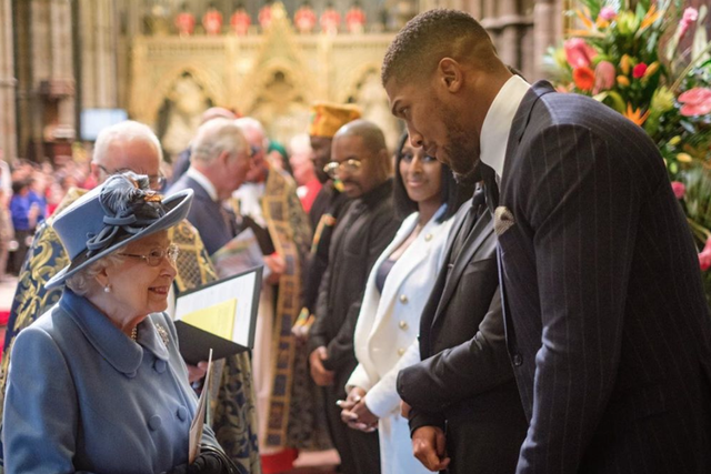 Anthony Joshua met Prince Charles (background) and The Queen on 9 March