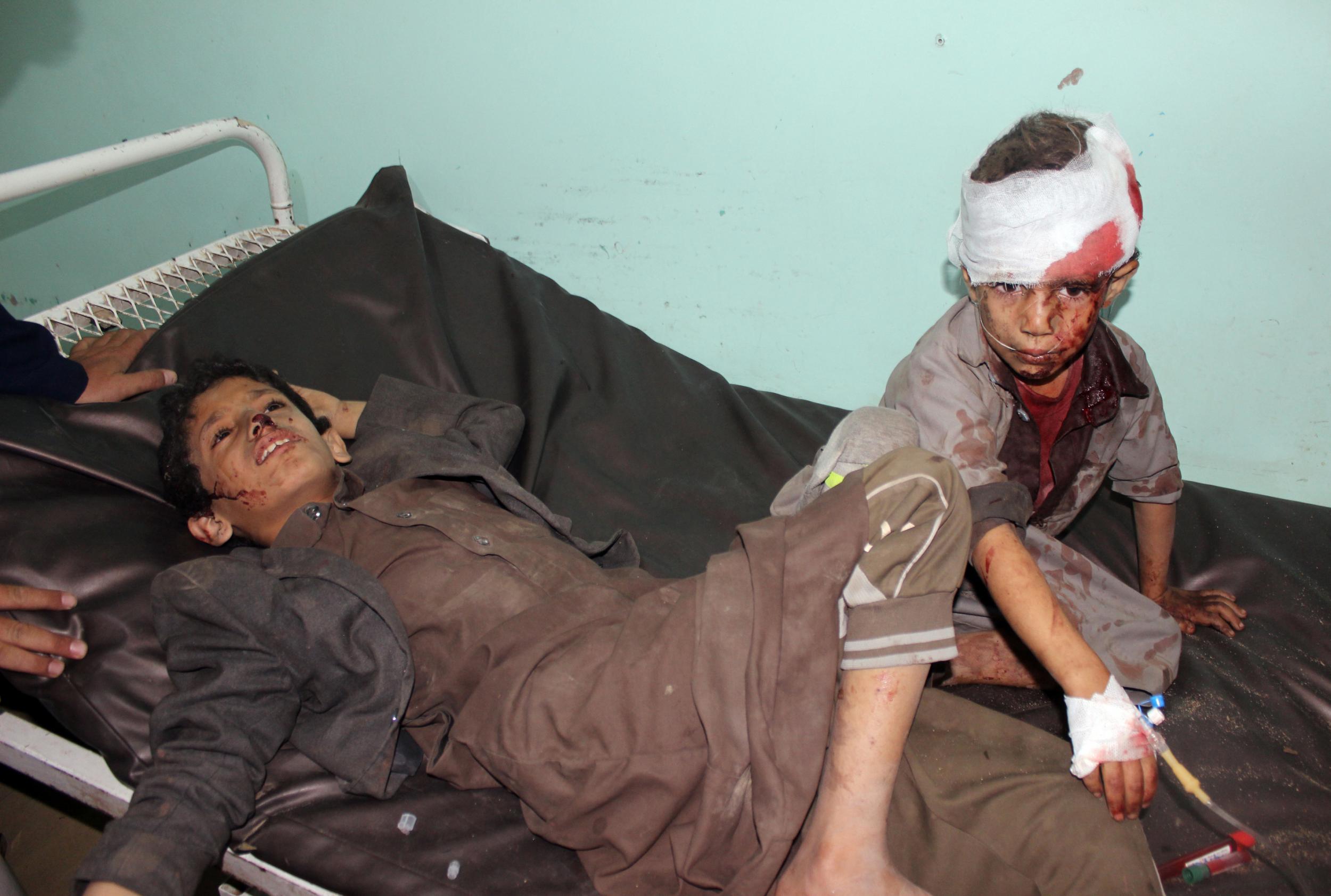 Yemeni children receive treatment at a hospital after being wounded in an airstrike on a school bus in Saada (Stringer/AFP via Getty Images)