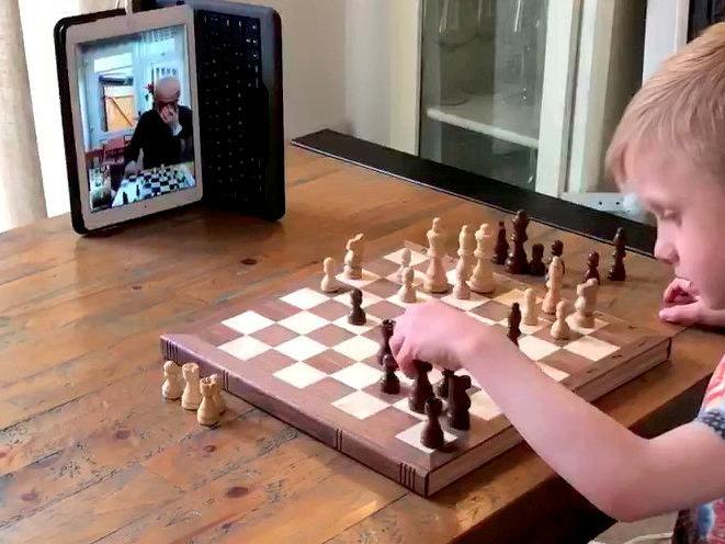 Ruben plays chess with his 71-year-old grandfather over FaceTime