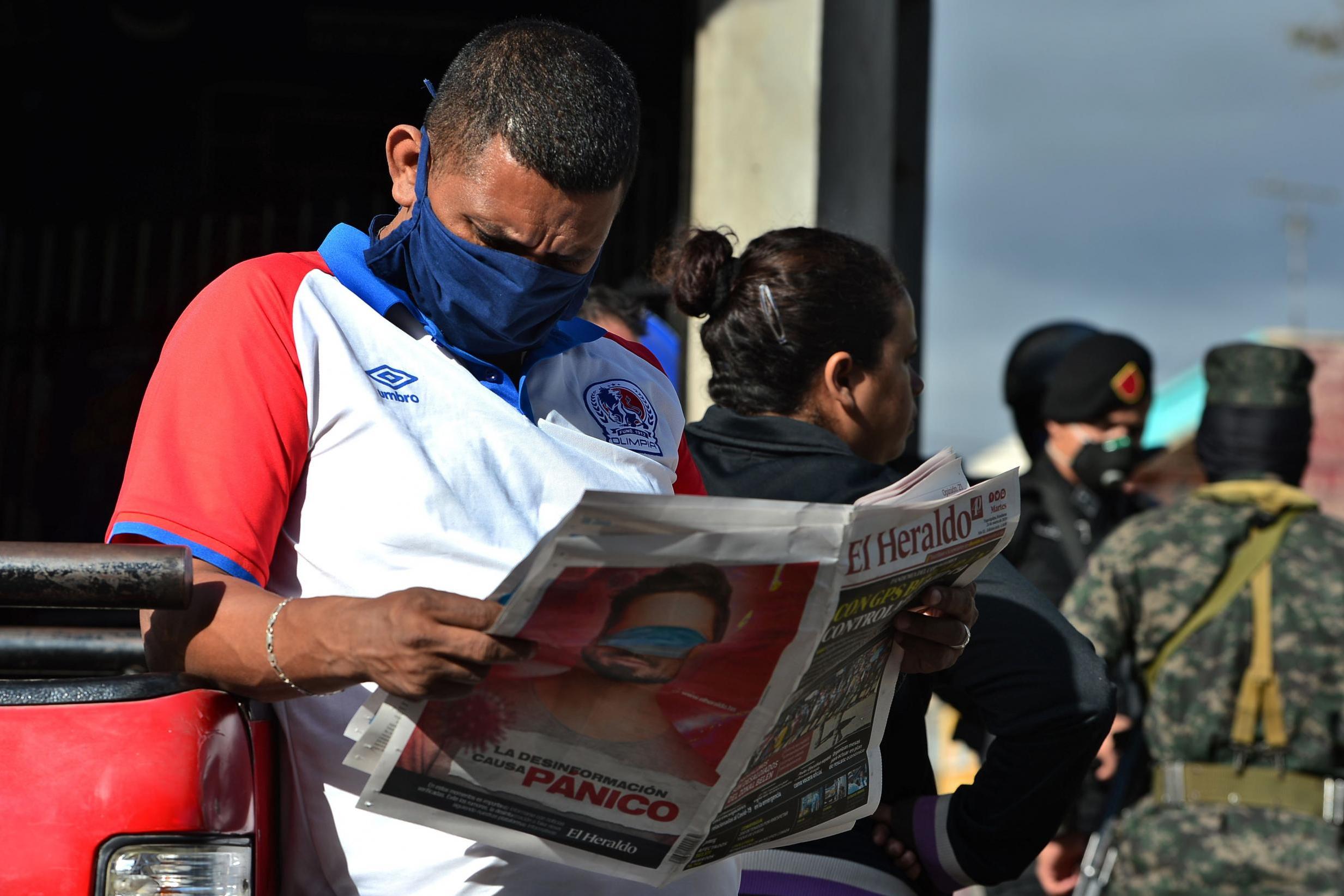 A man in Tegucigalpa last week, days before the Honduras government decreed ‘an absolute curfew’ (AFP/Getty)